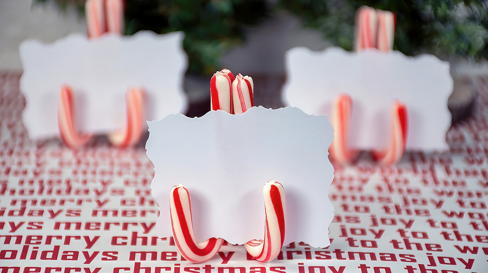 Elevate Your Holiday Dinner Party Tablescape With A Candy Cane Card Holder Hack