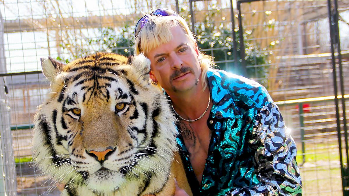 Tiger King star Joe Exotic shows off NEW longer mullet in prison mugshot - as star continues bid for freedom amid 21 year sentence