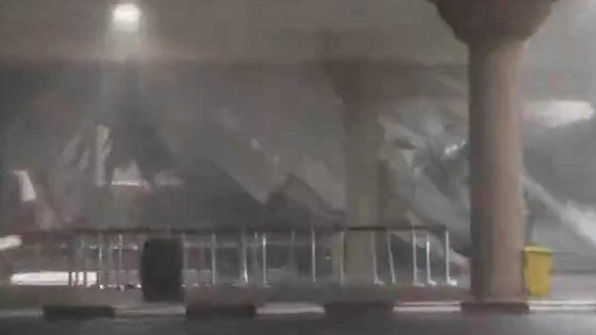 Dubai storm's most shocking moments caught on camera: Terrifying videos show debris crashing through underpass, giant hailstones, flooded buildings and flying furniture caught in the eye of the storm