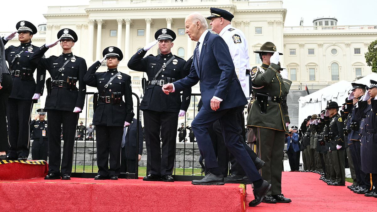 Clumsy Biden, 81, catches himself after tripping on a step again