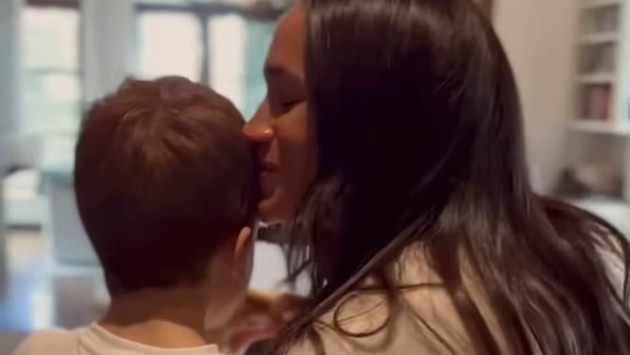 Excited Archie has sweet conversation with Meghan Markle as they feed koi in their fish pond during 'cosy' weekend at home