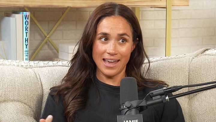Meghan Markle breaks down in tears and appears to make thinly-veiled dig at the Royal Family in podcast with billionaire friend