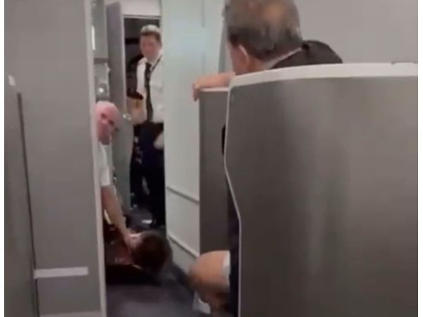 Watch as old lady flung to the ground by staff after she tried to enter cockpit