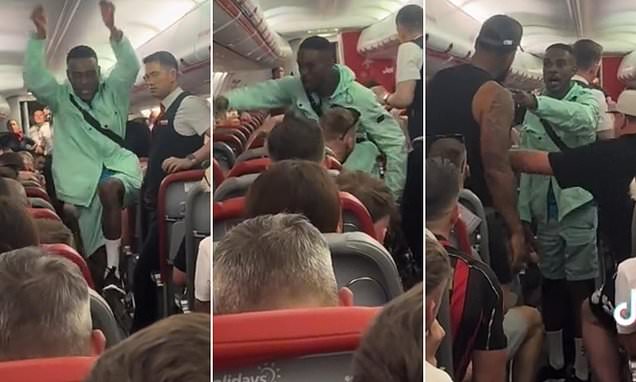 Moment 'feral' Brit tries to provoke passenger on chaotic Ibiza flight