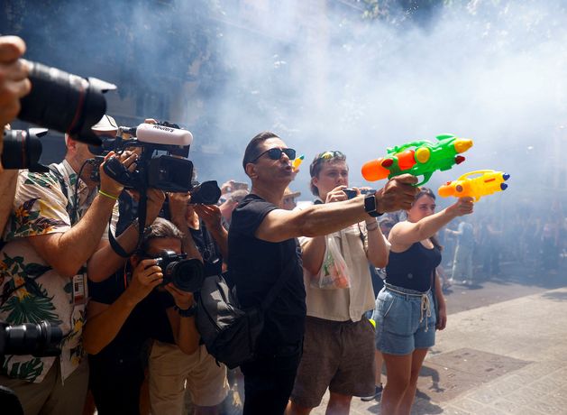 ‘Your holidays, my misery’ – overtourism protesters take to the streets of southern Europe