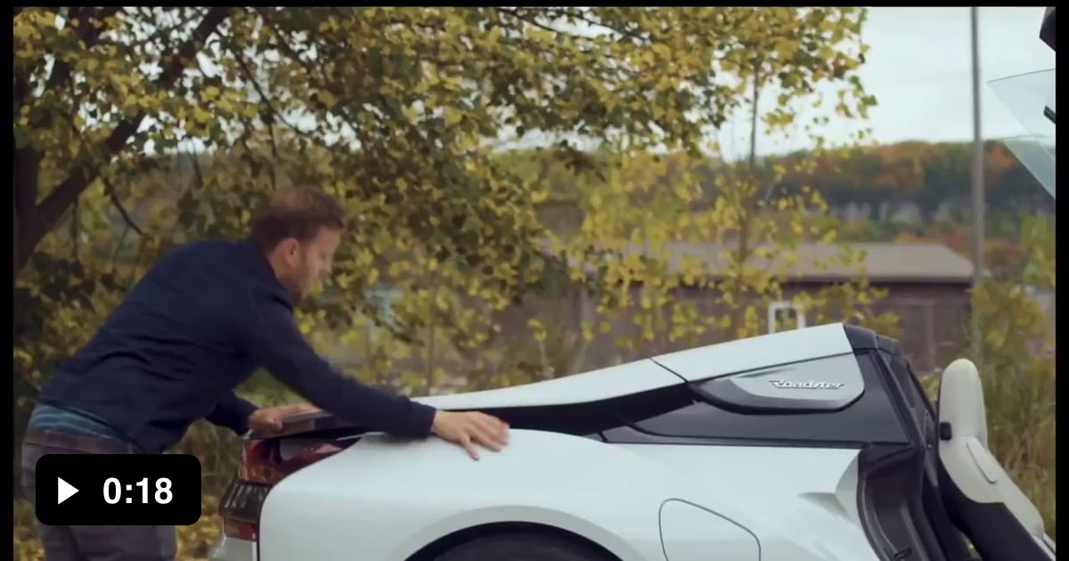 An expert shows how to properly get into a BMW i8.