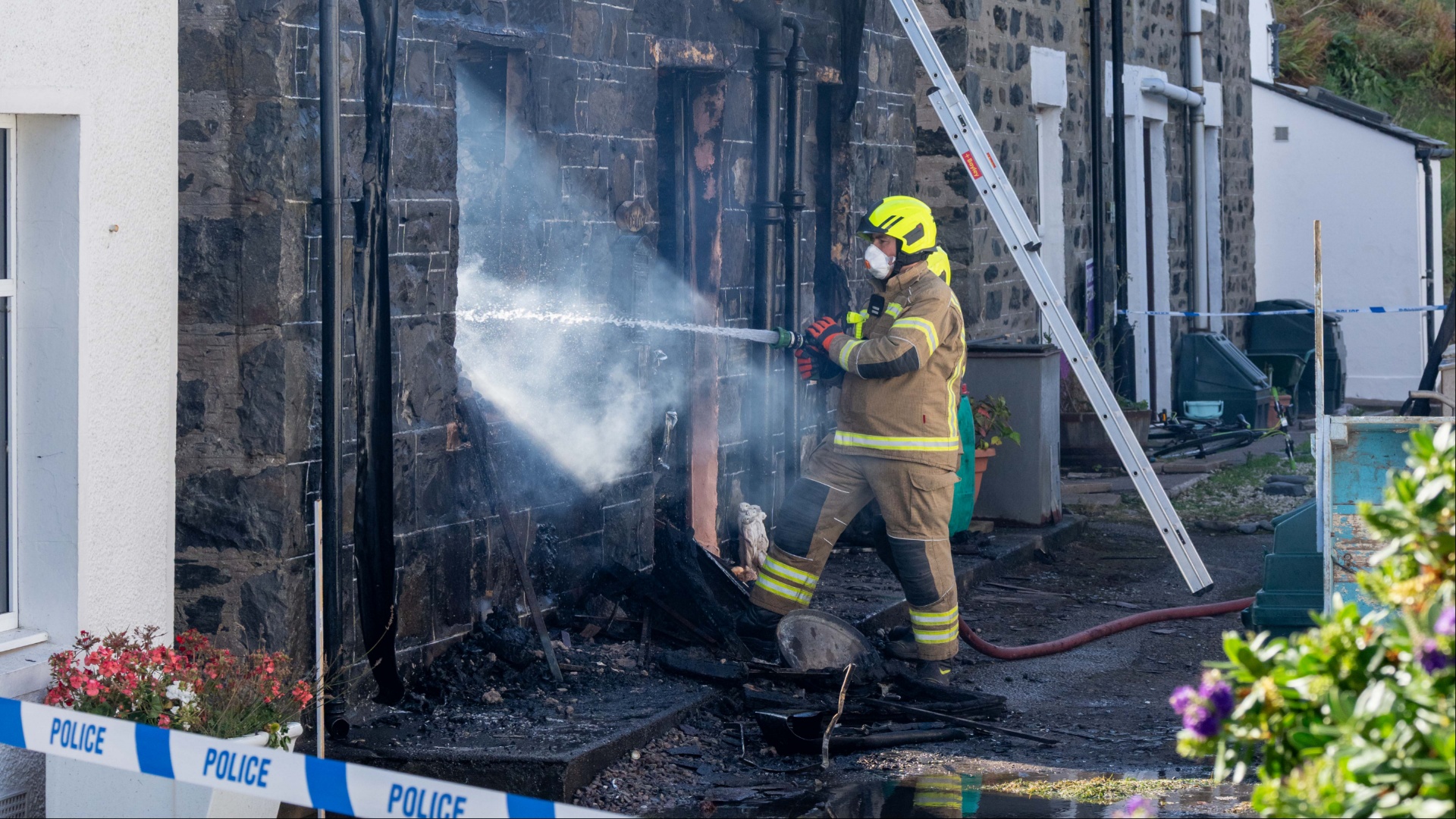 Woman feared dead after house blaze in Scots village as man rushed to hospital