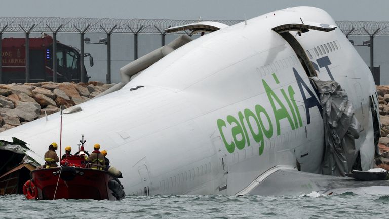 Cargo plane slides off runway in Hong Kong - reports say two dead