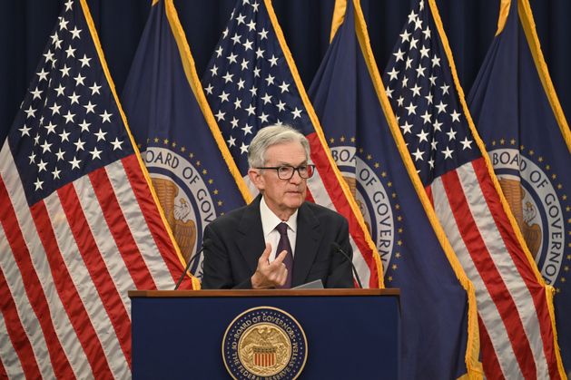 US Federal Reserve cuts interest rates but warns inflation remains high