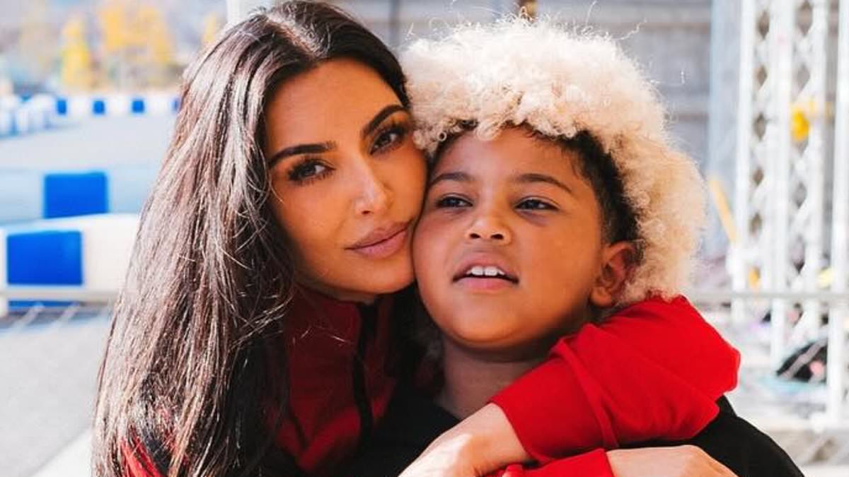 Kim Kardashian channels boyfriend Lewis Hamilton's F1 look in helmet and racing suit on family trip to Tokyo