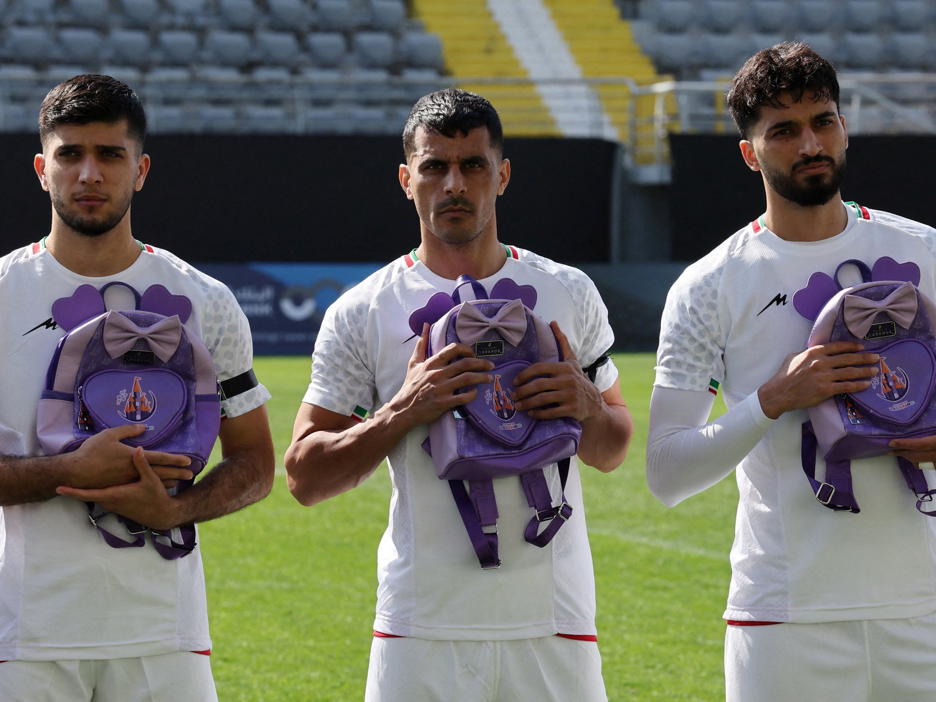 Iran footballers pay tribute to victims of school strike at start of war